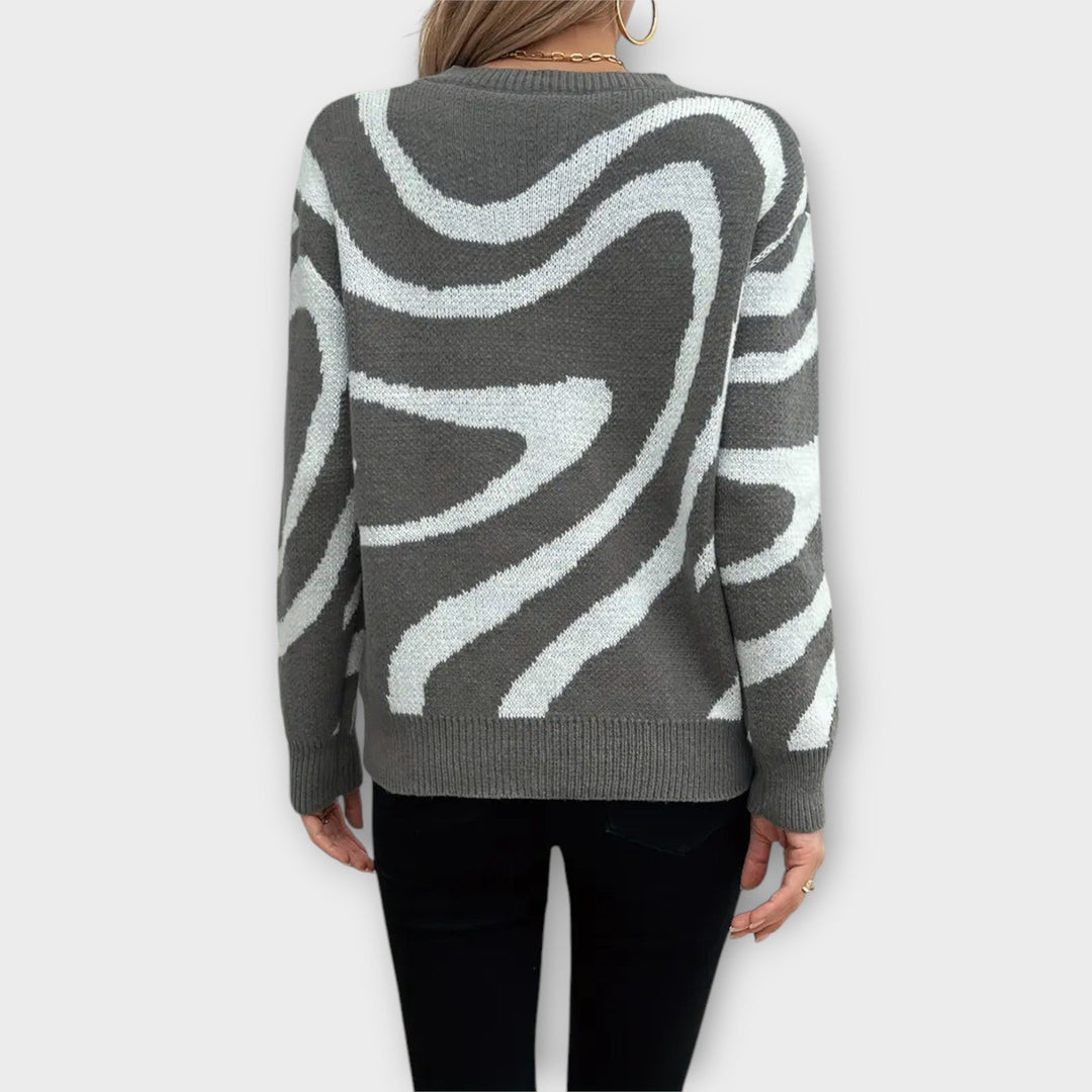 Larissa - Grijs en wit pluche trui met zebrapatroon